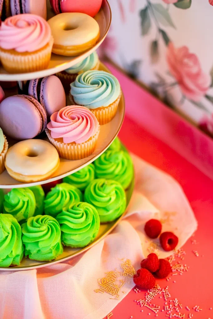 dreamy pastel dessert table with cupcakes, donuts, macarons, soft lighting, aesthetic setup, cozy vibe, high detail, Pinterest aesthetic style